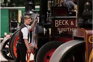 Boy looking at steam engines