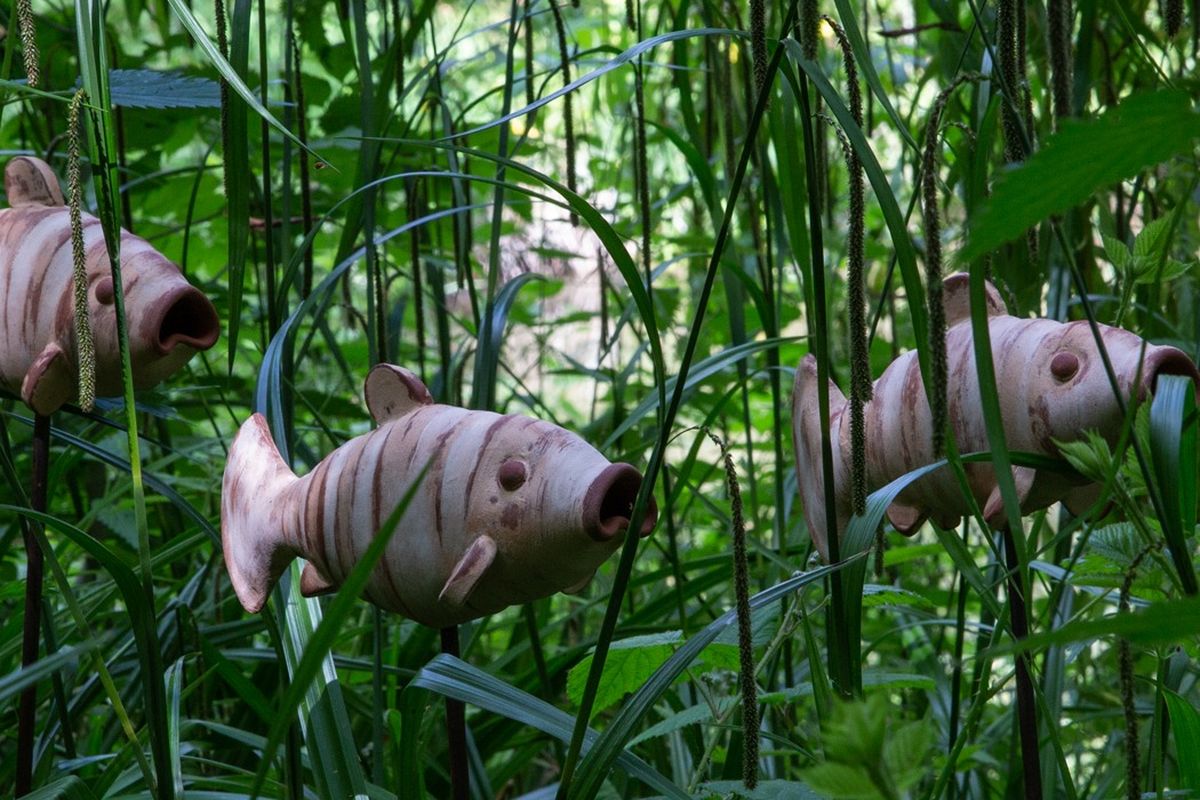 3 Fish sculptures in the long grass