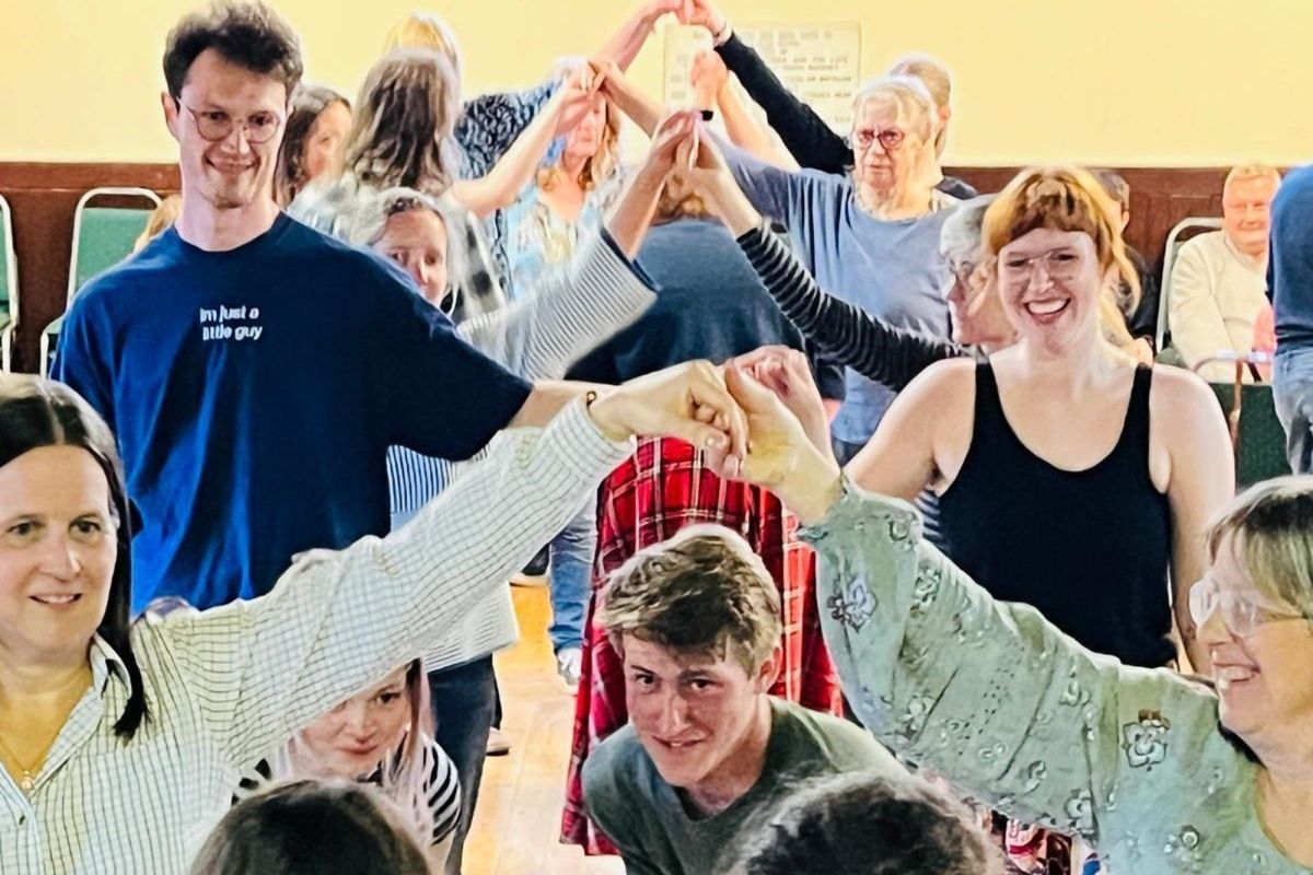 Group of people taking part in a ceilidh dance