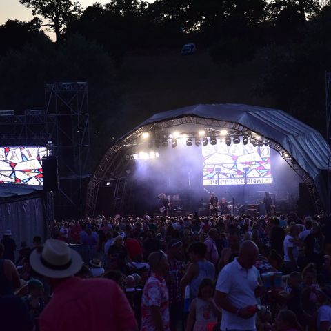 Crowd around a stage enjoying the music