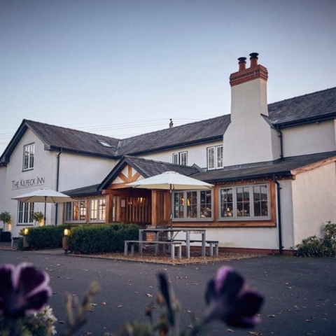 village pub set against a blue sky