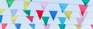 Festival bunting against a blue sky