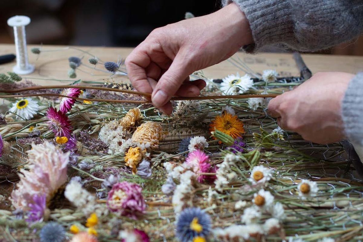 Person making a flower panel