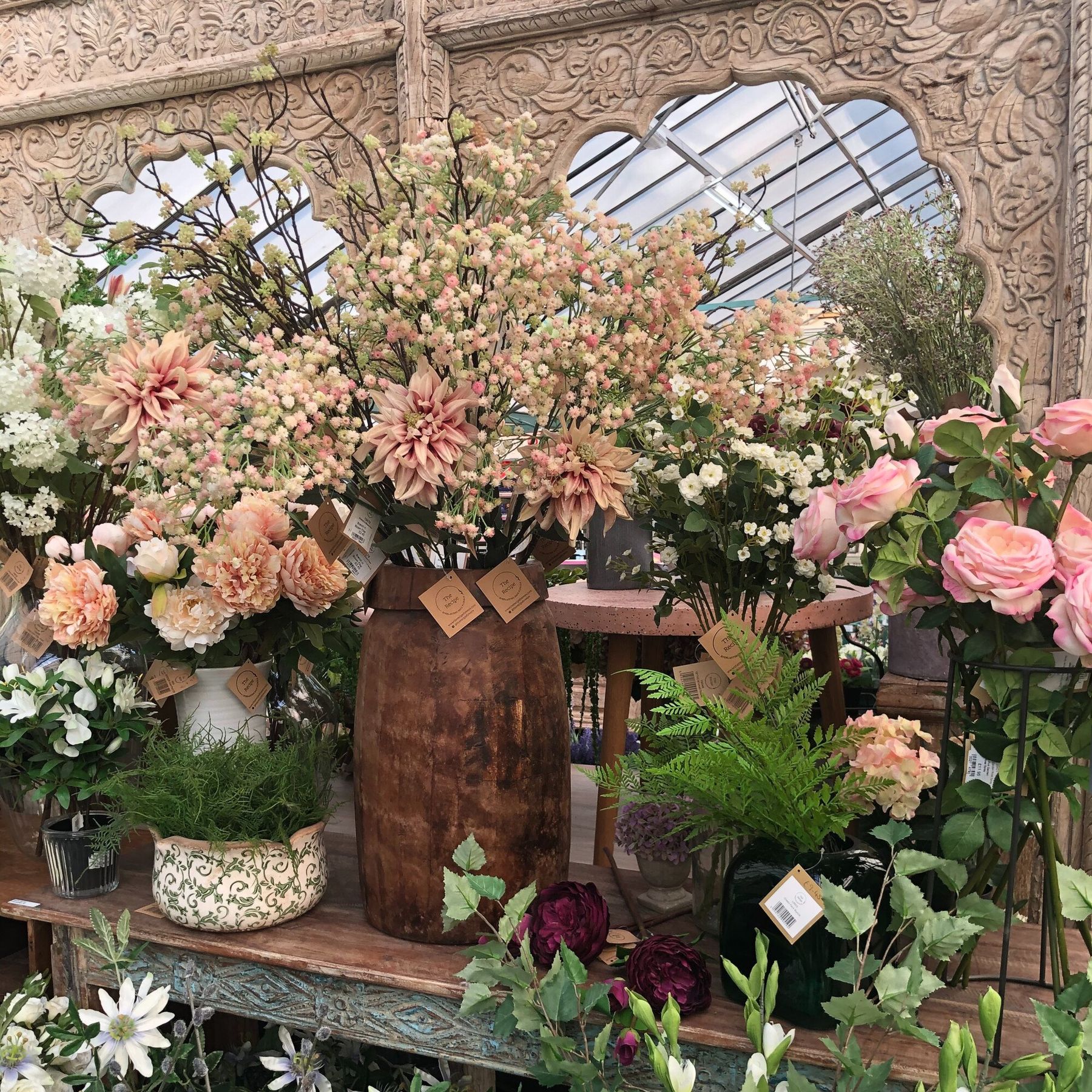Silk flowers looking lovely against the salvage.