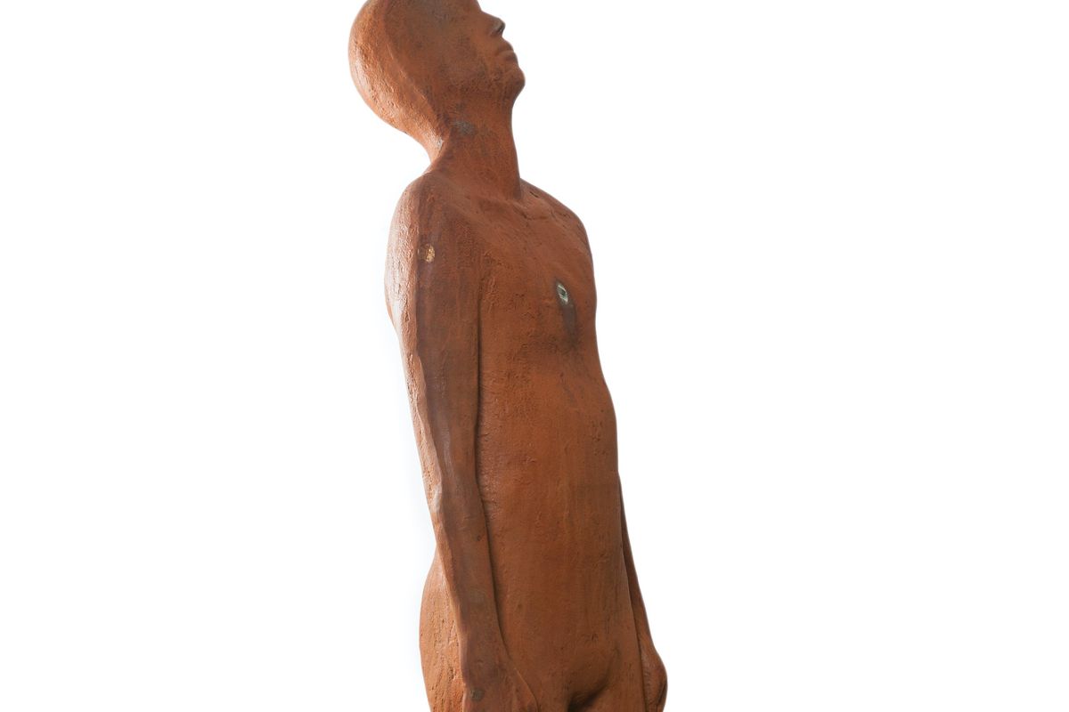 cast iron sculpture of figure