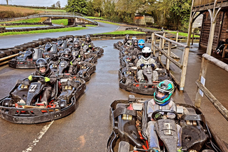 Go karts lined up on the track 