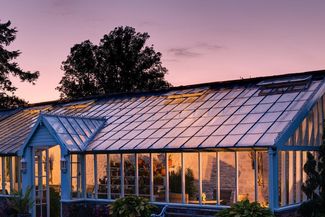 Glass house at sunset