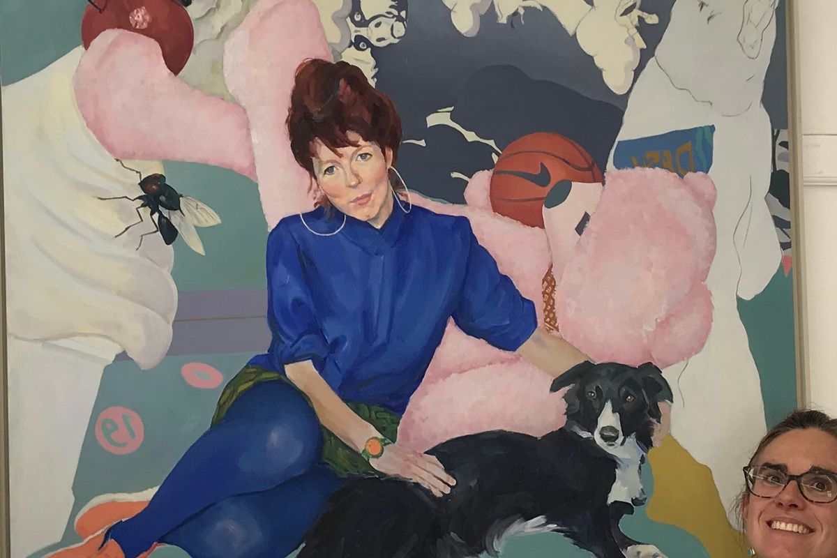 person with a large painting of a woman, dogs, bee and plants