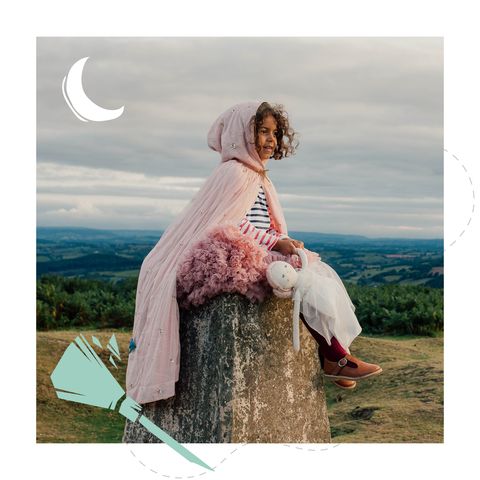 Girl sits at the peak of Garway Hill