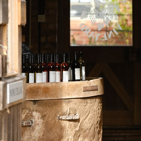 wine on barrel with door open letting sun into shop