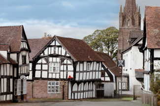 Quaint Herefordshire village scene with houses and a church