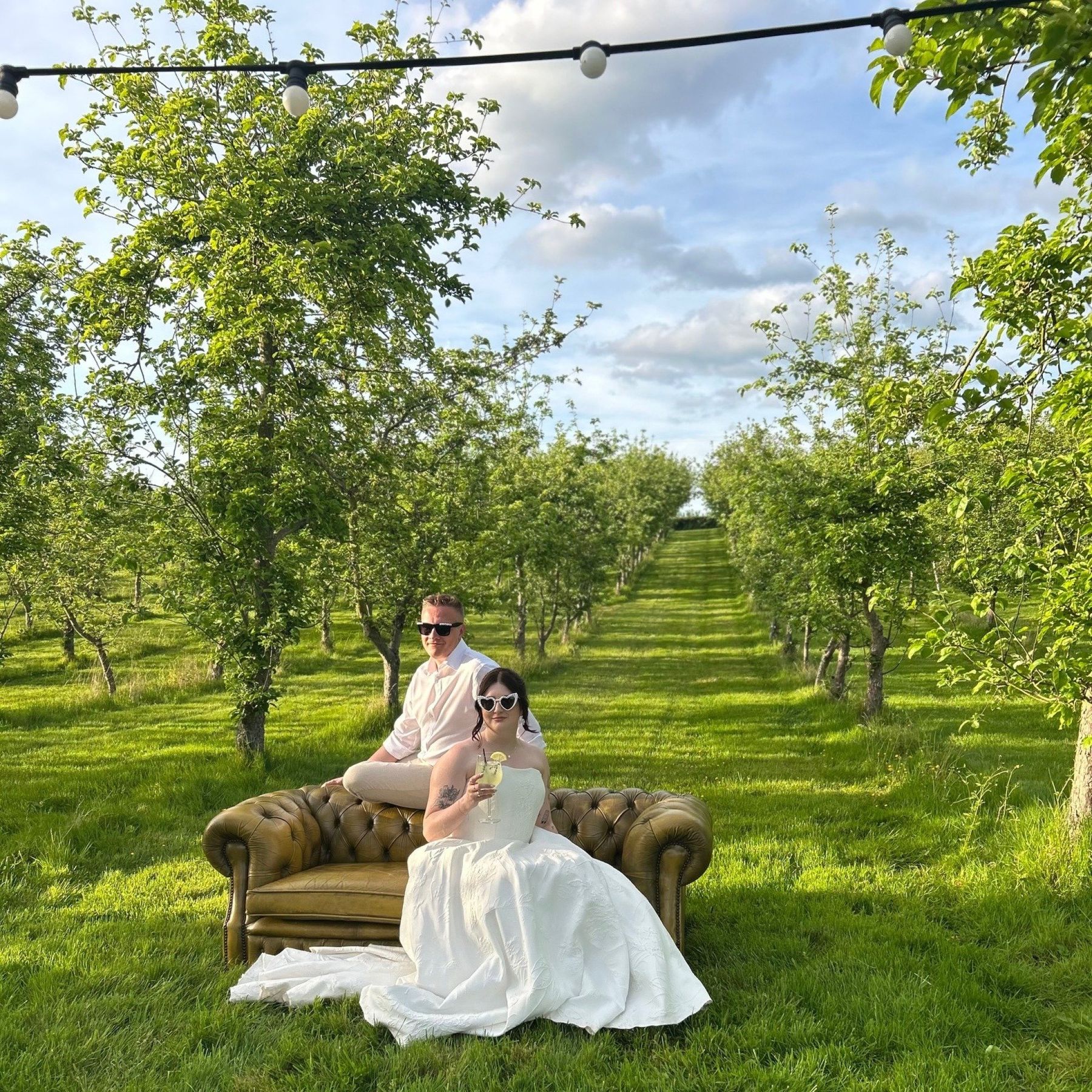 bride and groom in the orchard