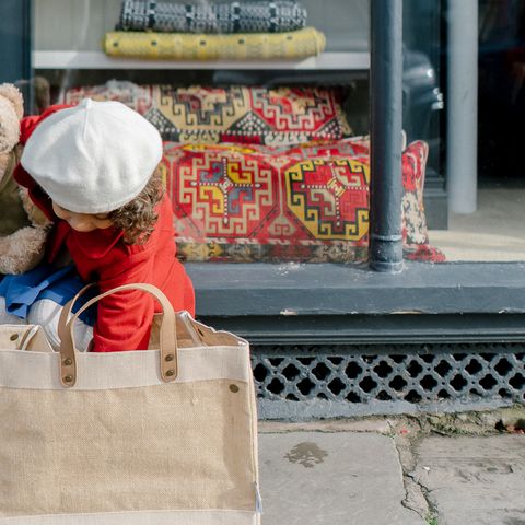 Girl with Shopping bag outside shop