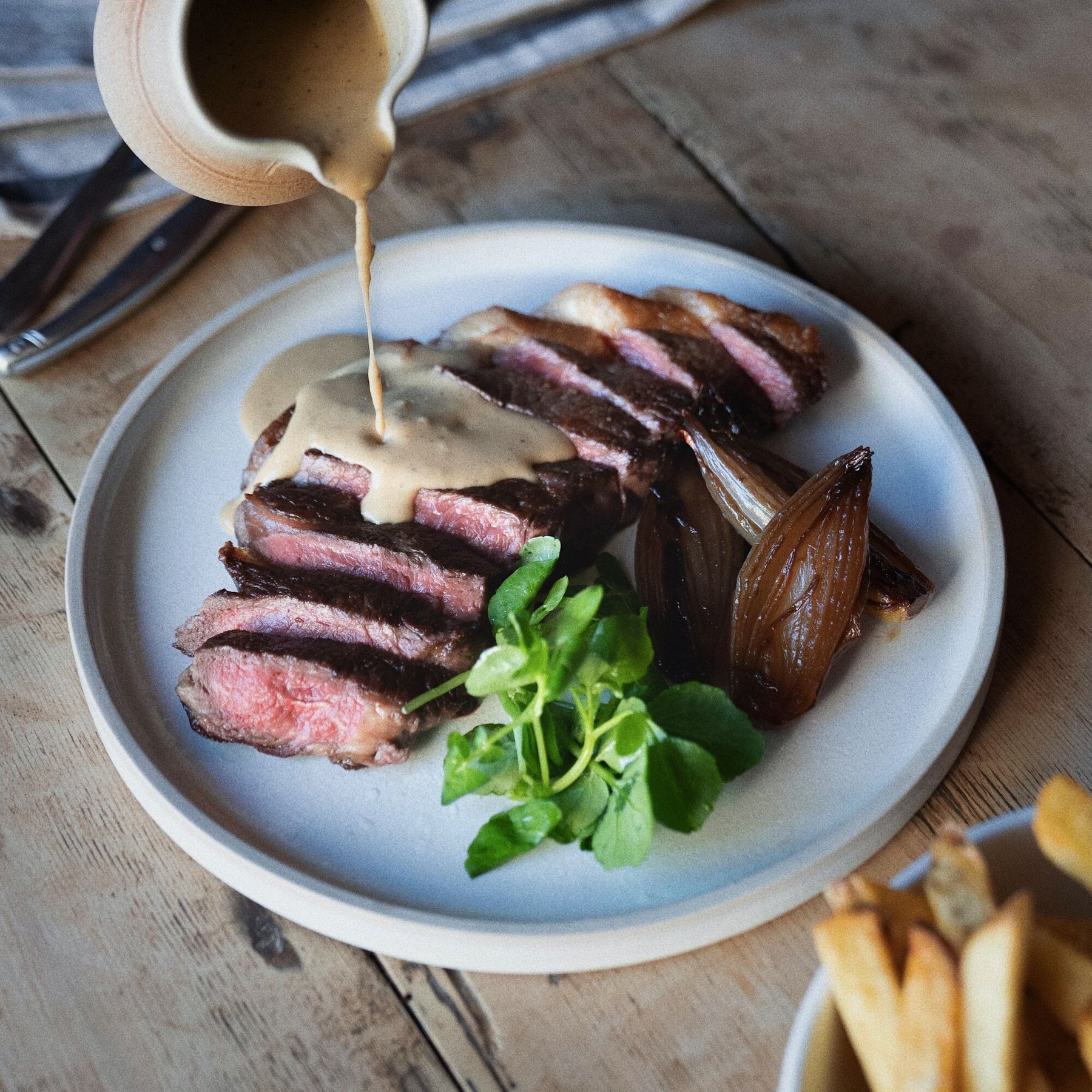 60 Day Dry Aged Ribeye Steak, Beef Dripping Chips, Beer Shallot, Peppercorn Sauce