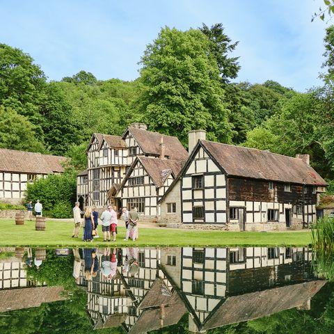 Lakeside view of Tudor manor