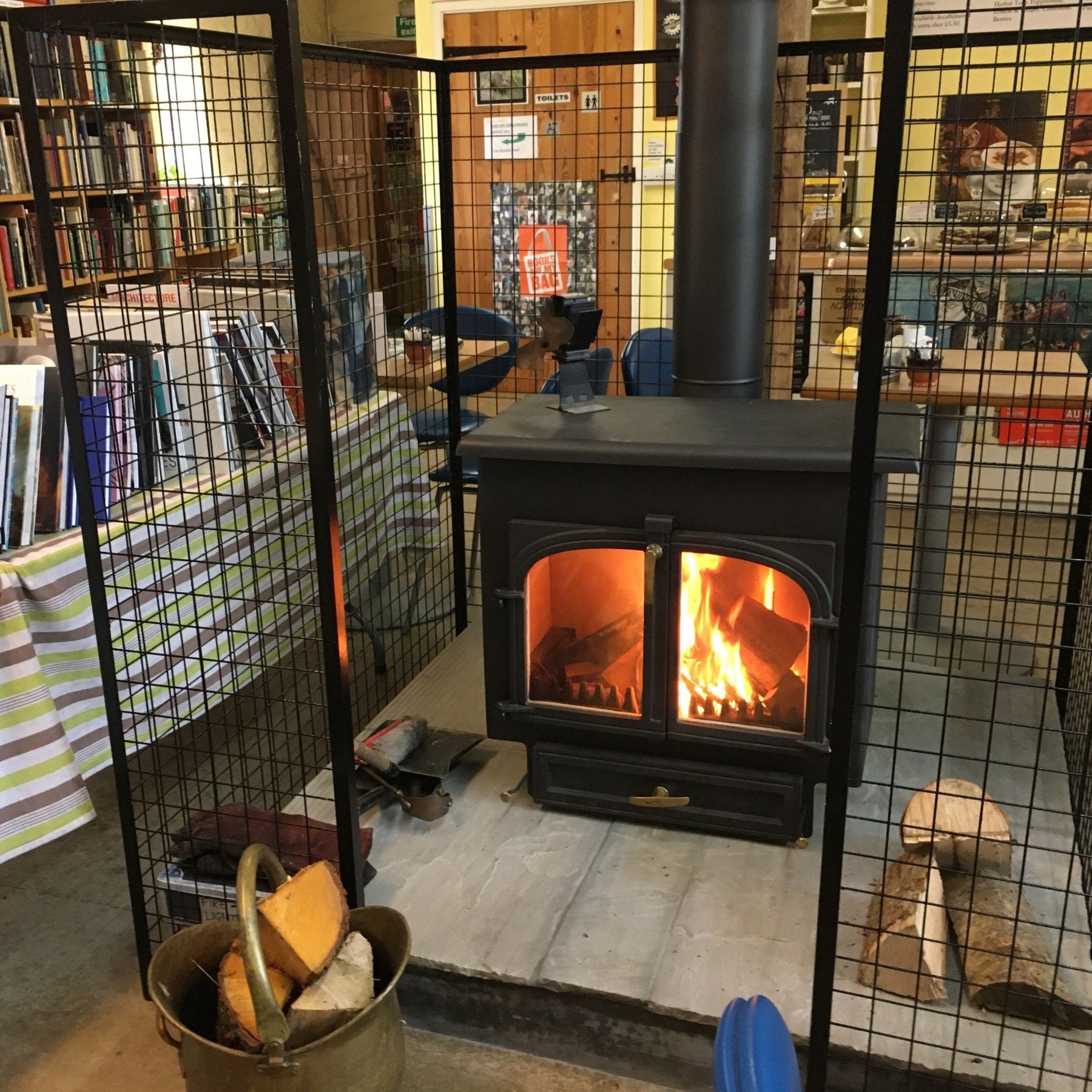 The wood burner in the middle of the bookshop
