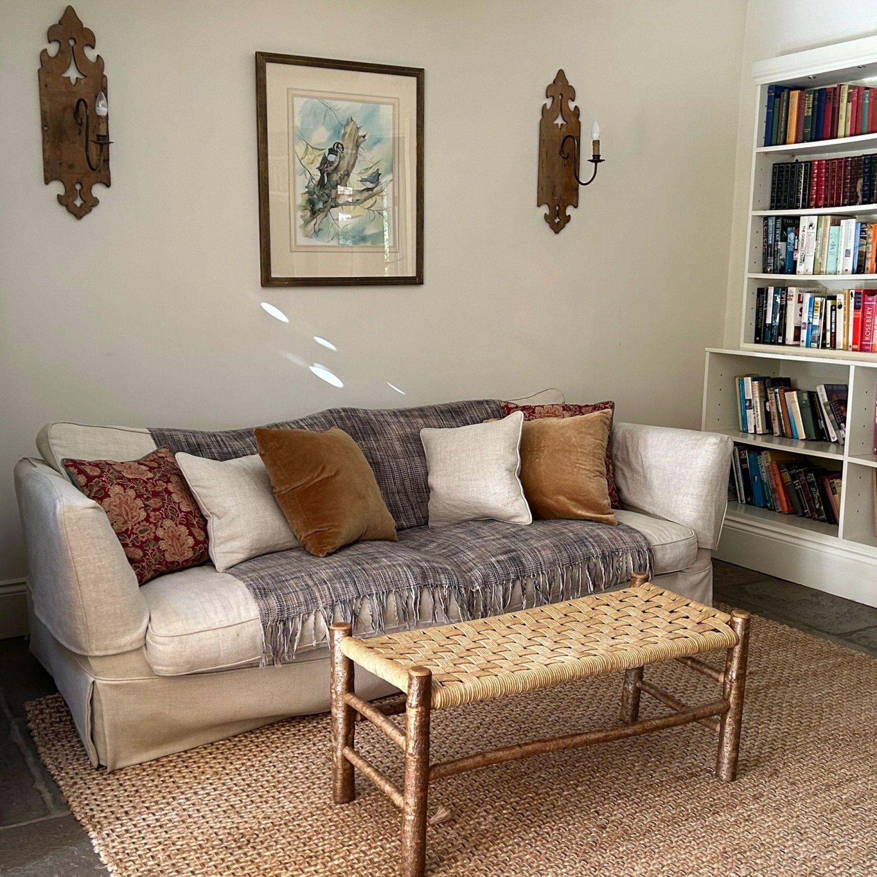 The snug full of books, underfloor heating and a woodburner