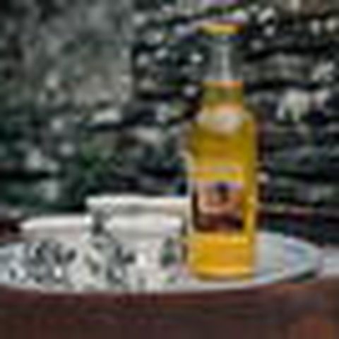 Bottle of Cider with mugs