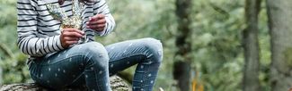 Girl roasts marshmallows in woodland