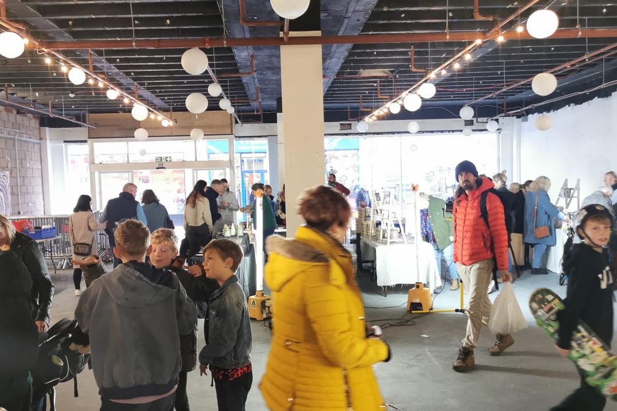 people attending a ceramics market