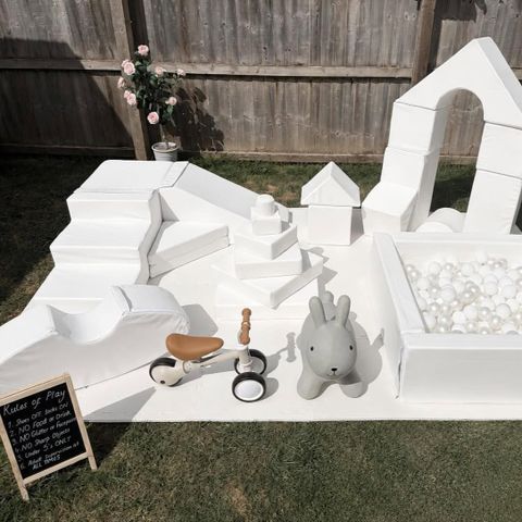 A selection of white soft play toys