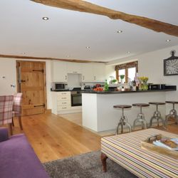 Open plan kitchen, dining and living area in Sunburst Barn