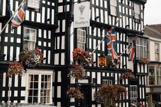 Black and white building with union flags flying