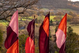 flags for hay festival against hill backdrop