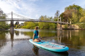 View of Victoria bridge from a paddleboard