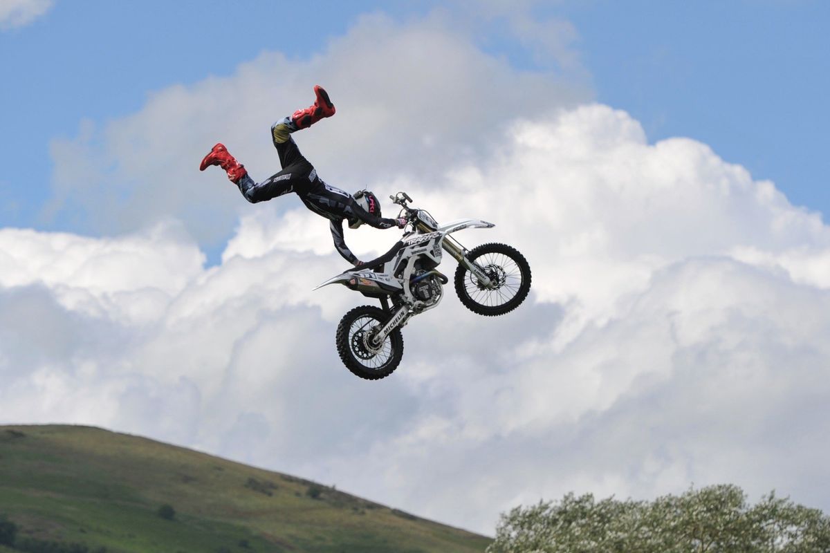 stunt biker rider performing trick