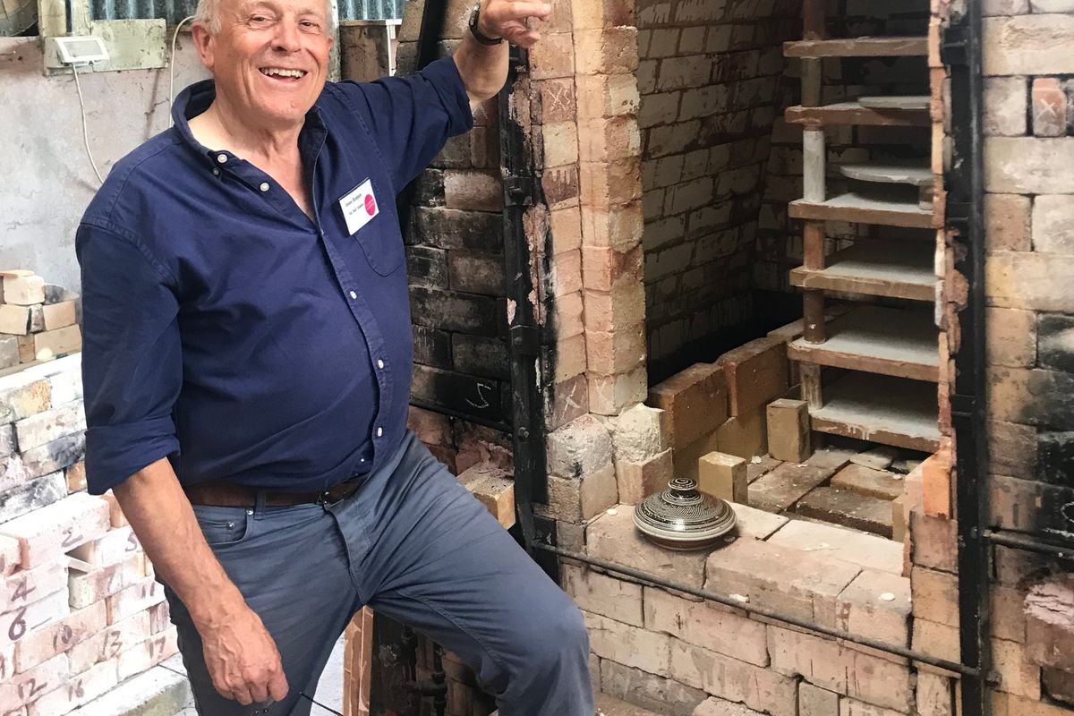 man with brick kiln oven