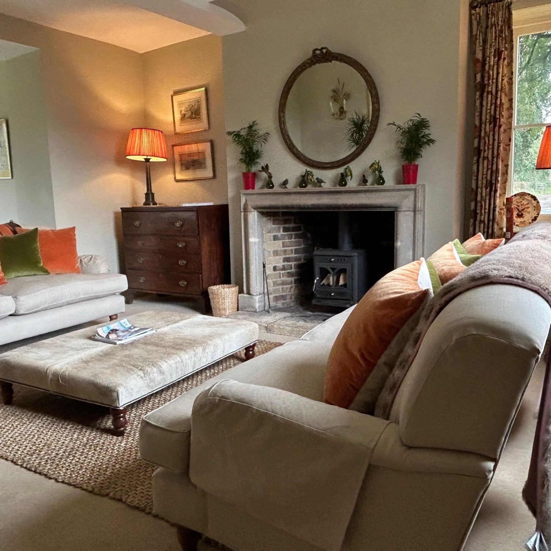 The elegant drawing room with woodburner and card table
