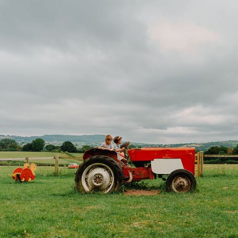 Kids playing on tractor at Rowlestone Court Farm