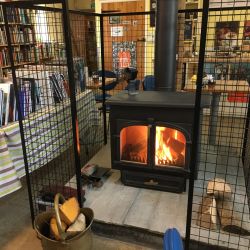 The wood burner in the middle of the bookshop