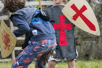 Kids playing medieval dress up 