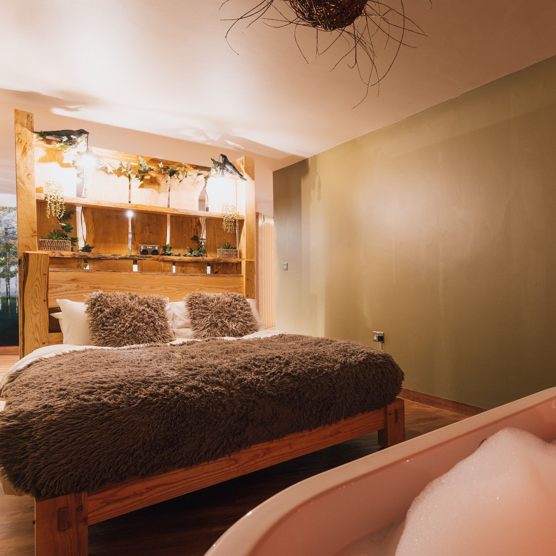 The Rooks Tower bedroom, with roll top bath.
