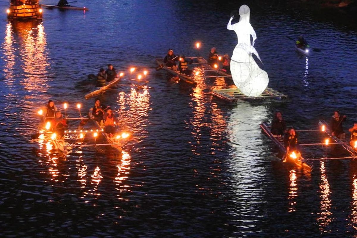 Illuminated craft float down the Wye