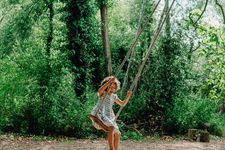 girl on rope swing at Hampton Court castle