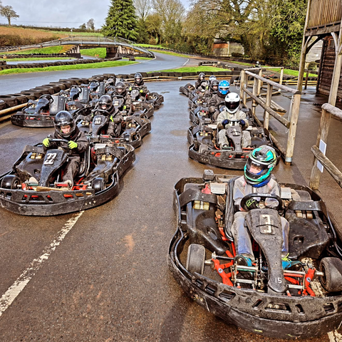 Go karts lined up on the track 