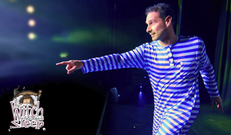 main in striped suit on theatre stage