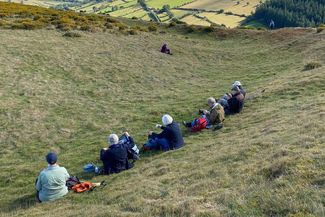 Walkers taking a break with scenic views