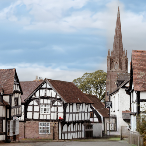 Quaint Herefordshire village scene with houses and a church
