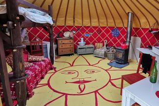 Bright and colourful yurt interior