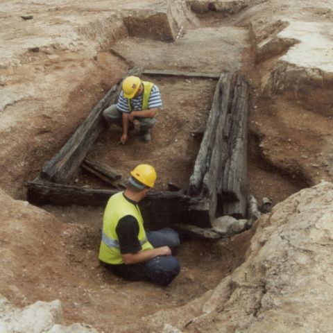 2 people excavating a ruin