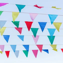 Festival bunting against a blue sky