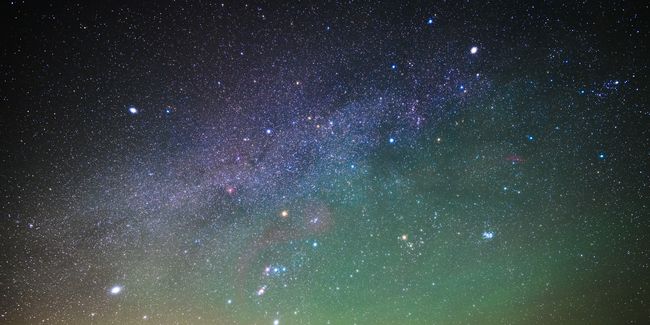 Arthurs Stone pictured at night, with a sky full of bright stars