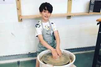 Boy at Potter's wheel