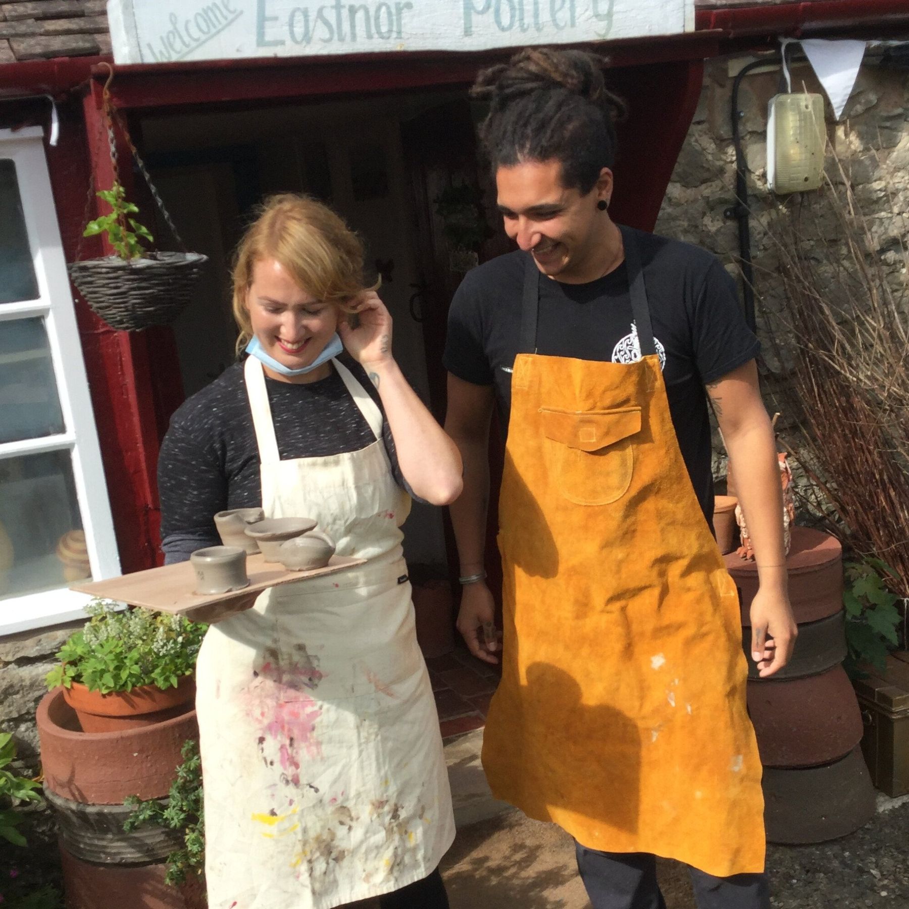a couple having just done an introduction to the potter's wheel at Eastnor Pottery